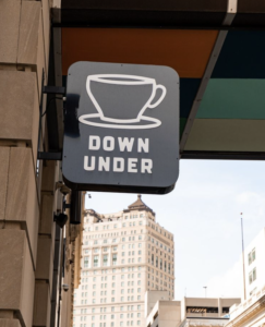 Coffee Down Under sign outside of the store, with the Westin Hotel in the background.